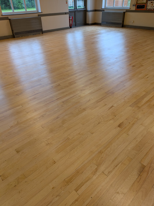 Worn oak church hall floor Preston restored - after